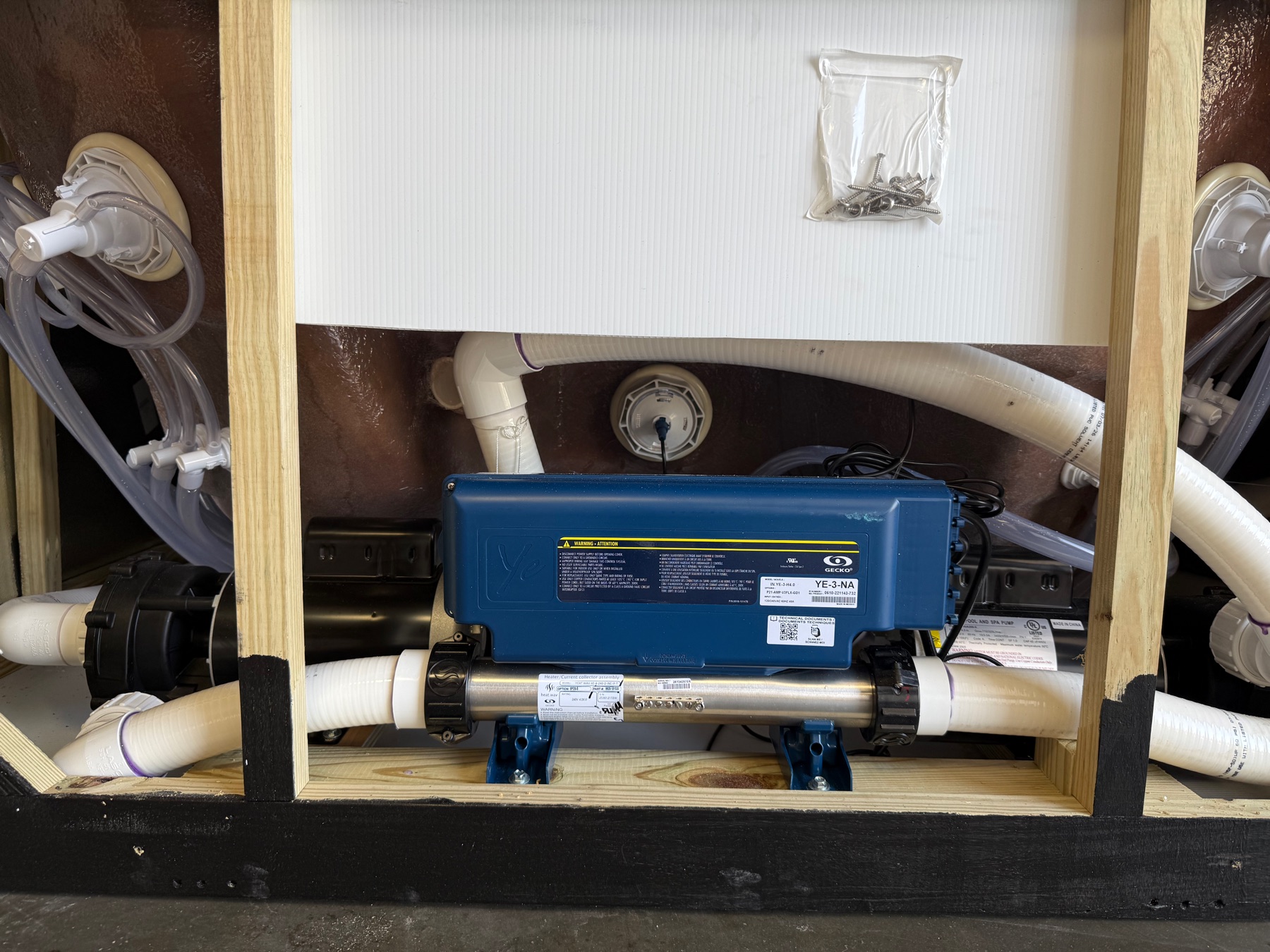 Gecko control pack and stainless steel heater installed in a Futura Spa