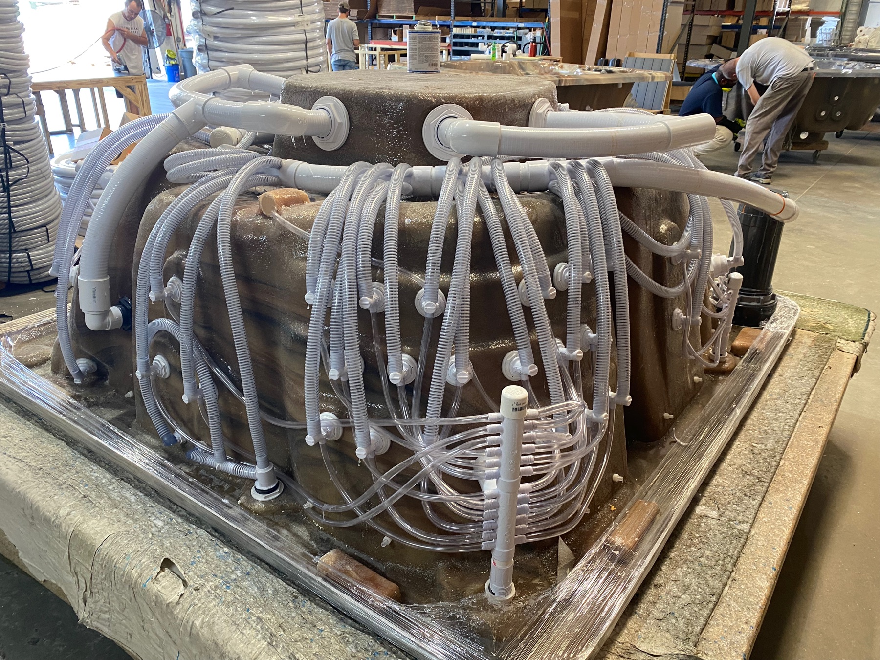 Plumbing lines routed across the underside of a Futura Spa